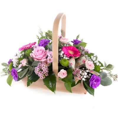 Sweet Harmony - A charming floral gift arranged in a rustic wooden basket, featuring a delightful blend of soft pinks, vibrant purples, fresh greens, and delicate white accents. Thoughtfully designed with a variety of textures and seasonal blooms, this arrangement creates a cheerful and elegant display that is perfect for brightening any room.

Beautifully presented and ready to enjoy, this basket arrangement makes a wonderful gift for birthdays, thank-you gestures, celebrations, new baby occasions, or simply to let someone know you're thinking of them.