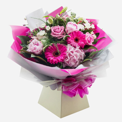 Pretty in Pink - A delightful bouquet bursting with vibrant pink hues, soft pastel tones, and fresh seasonal greenery. Expertly arranged to create a beautiful balance of colour, texture, and elegance, this charming design is perfect for celebrating special occasions or sending a thoughtful message to someone special.

Presented in stylish contemporary wrapping and a coordinating gift box, this arrangement arrives ready to impress and makes a wonderful choice for birthdays, anniversaries, congratulations, thank-you gifts, or simply brightening someone's day.